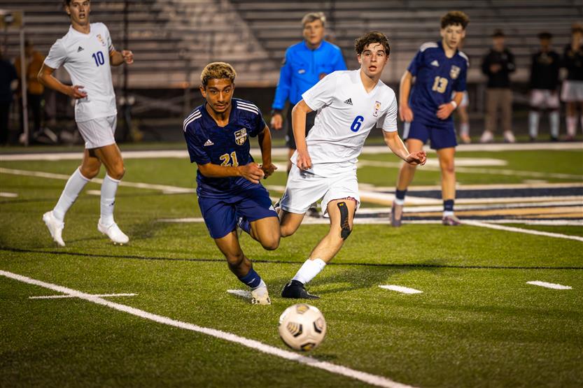 Students play soccer
